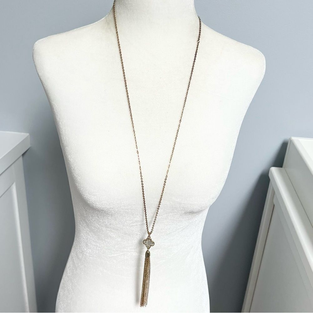 Jewel studded quatrefoil pendant tassel fringe gold tone necklace